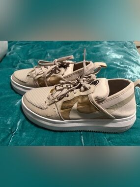 Nike Low-Top Sneakers in Cream with Gold Accents